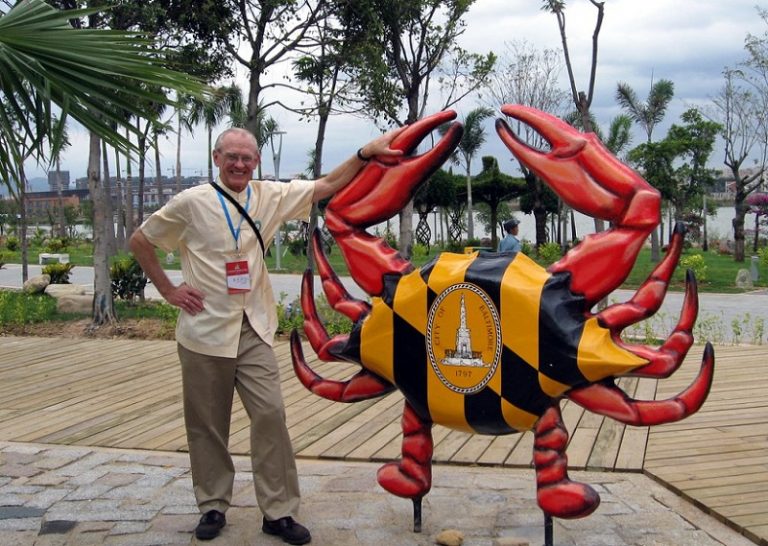 W. Fontaine Bell beside Baltimore’s crab sculpture at the Xiamen garden exposition, 2007